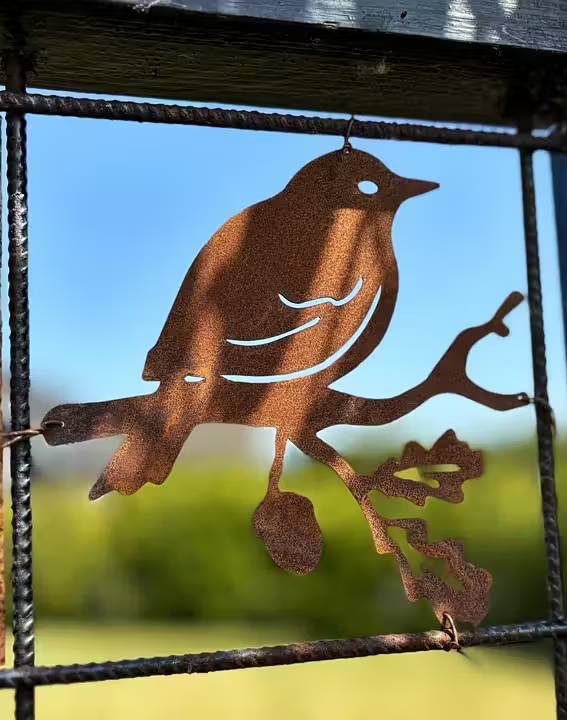 Dekoration til rionet Fugl på gren i cortenstål